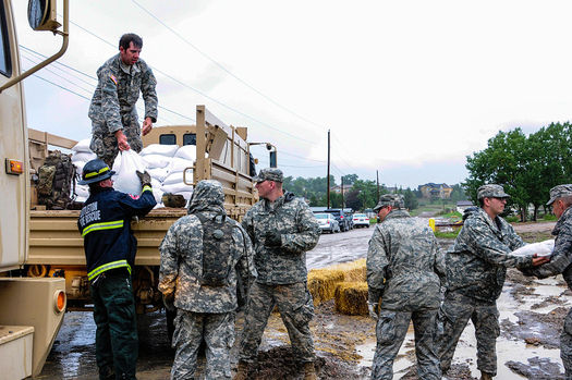 Air National Guard workers stack sandbags to minimize damage from floodwaters in 2013. (Wikimedia Commons/Air National Guard Staff Sgt. Nicole Manzanares)