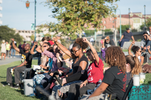 Attendees show their support at the Night Out For Safety and Liberation in Oakland, Calif., in 2015, a rival event to the National Night Out. (Brooke Anderson)