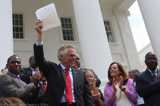 As Gov. Terry McAuliffe signs orders restoring voting rights to reformed Virginia felons, many are questioning the law making that necessary. (Michaele White/Governor's Office/Flickr)