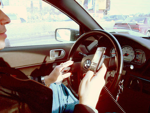 In 2014, more than 3,100 people were killed and 431,000 injured by distracted drivers. (Ed Poor/Wikimedia Commons)