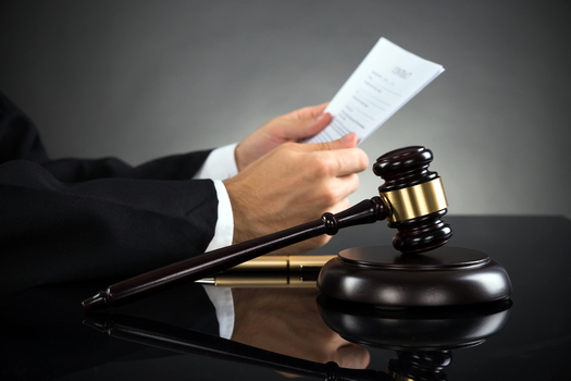 There's a hearing today in federal court over U.S. Department of Justice claims that Texas officials aren't properly educating voters about changes in the state’s Voter ID law. (popov/iStockphoto)