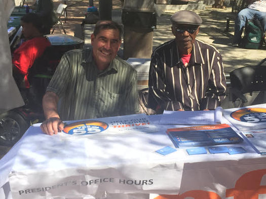 Ed Jaramillo, left, president of the Peralta Federation of Teachers, and Al Young, right, manned a table at a Prop. 55 event at Laney College in Oakland on Tuesday. (Fred Glass/Calif. Federation of Teachers)