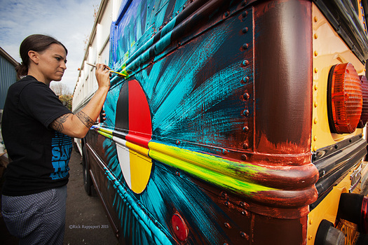 Native American artist Clay with the Native American Youth and Family Center provides a mural for a side of the Bunk Bus. (Rick Rappaport)
