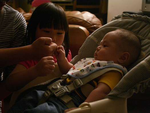 Sometimes a fist bump can suffice for children to show affection toward family members, says Taryn Yates of the Idaho Children's Trust Fund. (mliu92/Flickr)
