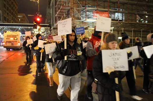 Marchers carry signs with the names of those who have died homeless in Minneapolis. (Minnesota Coalition for the Homeless)