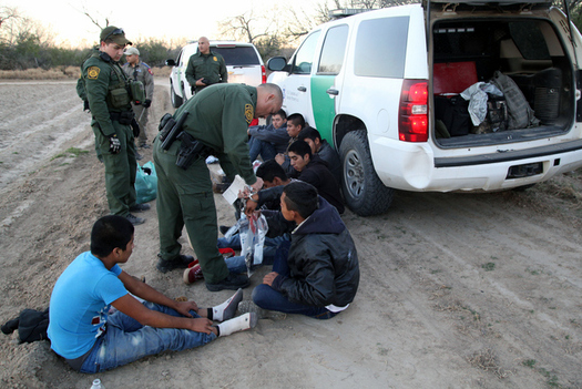 Border Patrol agents detain a group of unaccompanied Central American children shortly after they crossed the border into the United States. (vichinterland/iStockphoto)