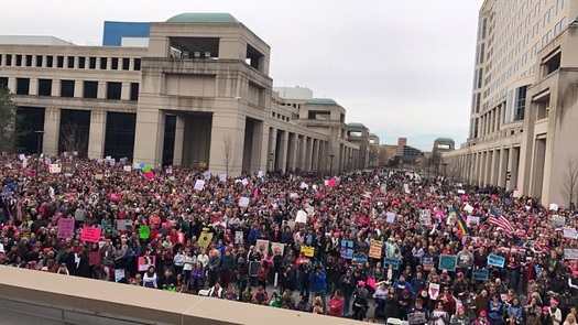 Thousands participated in marches for human rights in Illinois this weekend, and were urged to stay involved in their communities and in politics. (V. Carter)