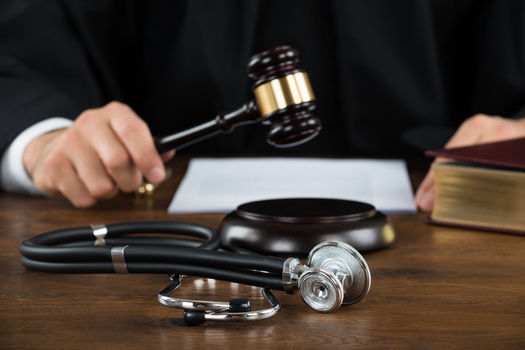 A new poll shows opposition in several primarily Republican states to a bill in Congress that would restrict a patient's ability to sue for malpractice. (AndreyPopov/iStockphoto)