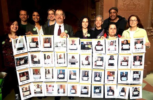 Advocates at the State Capitol displayed a mosaic of New Yorkers who want peoples commissioners on the Public Service Commission. (K. Roache)