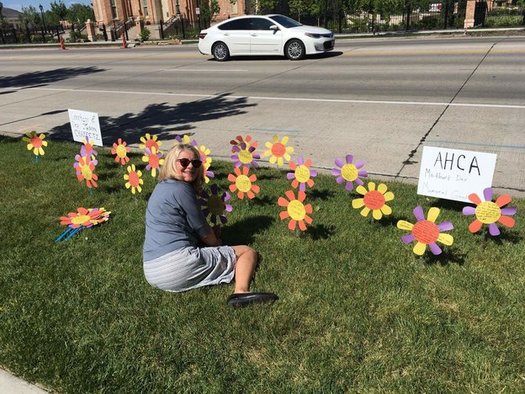 Activists planted more than 300 paper flowers outside the offices of Utah's congressional delegation yesterday, each with a testimonial from a resident concerned about the American Health Care Act. (Courtney Henderson Marden)