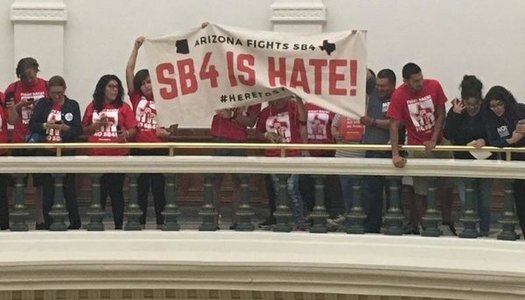 Protestors from Arizona joined a large group that disrupted the last day of the legislative session in Austin, Texas, on Monday, to oppose a bill similar to SB 1070. (Promise Arizona)