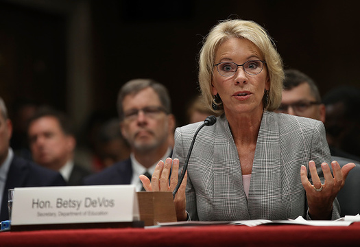 Washington and 18 other states are suing U.S. Education Secretary Betsy DeVos for failing to implement regulations on for-profit colleges as scheduled on July 1. (Win McNamee/Getty Images)