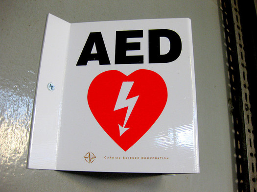 A survey shows half the employees in the United States don't know where the AED is at their workplace, much less how to use it. (Leon Brocard/flickr)