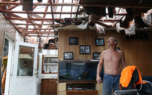 Aaron Tobias inspects what is left of his Rockport home after Hurricane Harvey made landfall Saturday as a Category 4 storm with 130-mph winds. (JoeRaedle/GettyImages)