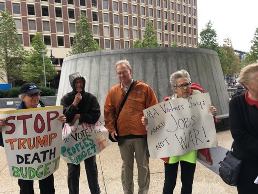 Some in Massachusetts are protesting the potential effects of $5.5 trillion in tax cuts proposed by U.S. House Speaker Paul Ryan. (C. Harrison)