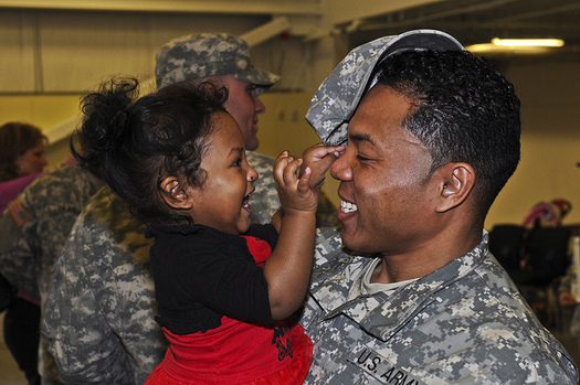 Increasing opportunities for parents help create economic stability for families of all races. (Pfc. Loren Cook/Flickr)
