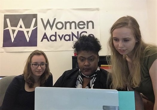 Women AdvaNCe Executive Director Naomi Randolph (center) works with staff members to coordinate the upcoming North Carolina Women's Summit. (Women AdvaNCe)
