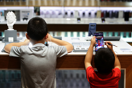 According to one study, mobile media device use has tripled among young children aged 5 to 16 in the past six years. (Getty Images)