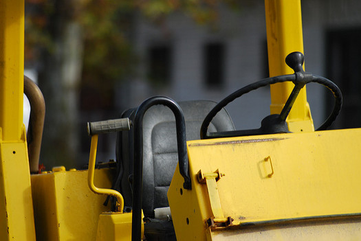 Many pieces of construction equipment and vehicles produce high emissions, but starting in January, two hospital systems in Charlotte will implement policies to limit their pollution. (Mahmoud Hashemi/flickr)