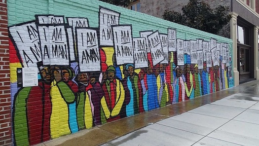 A mural in Memphis depicts the sanitation workers' strike 50 years ago. (Xzelenz/Wikimedia)