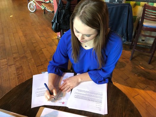 Some people visited Raleigh businesses Thursday to hand-write letters outlining their opposition to legislation that allows local officers to enforce federal immigration law. (Trey Roberts)