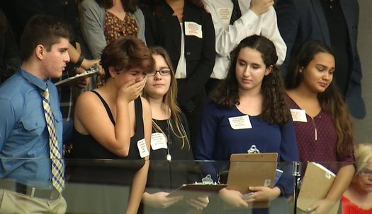 Sheryl Acquarola, a 16-year-old junior from Marjory Stoneman Douglas High School, is overcome with emotion in the East Gallery of the Florida House of Representatives. (Troy Kinsey) 