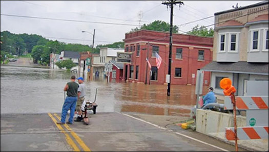 Spring flooding in Wisconsin can be devastating, as in Rock Springs in 2016, when the Baraboo River overflowed. Democrats say a bill under consideration would make flooding worse. (NOAA)