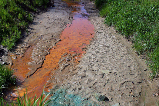 Acidic water runoff from coal mine land in eastern Kentucky. (Ilovemountains.org/Flickr)