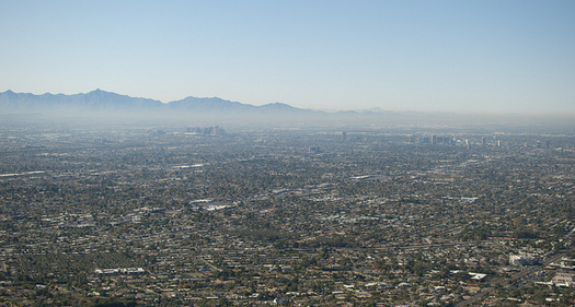 Phoenix's dry, warm climate historically made it a haven for people with respiratory ailments, but now that heat and sunshine are contributing to dangerous smog levels. (Edward Blake/Flickr)