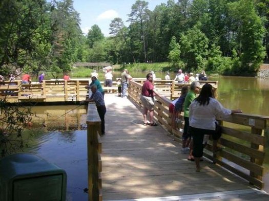 People enjoy access at Tumbling Rock Reservoir in Mount Airy, where they are able to fish and enjoy other activities, regardless of their level of mobility. (City of Mt. Airy)