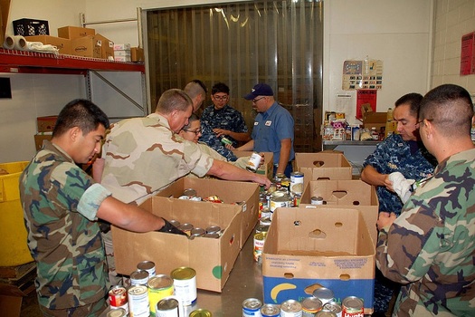 Military and civilian volunteers help sort and distribute food at the West Texas Food Bank in El Paso, one of 21 regional food banks across the state. (WikimediaCommons)