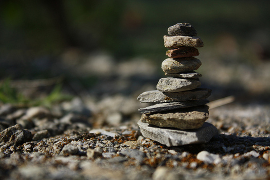 Rock piles, also known as cairns, are becoming popular things to build for hikers, but stacking rocks can damage the habitat for native animals and plants. (bulbocode909/flickr)