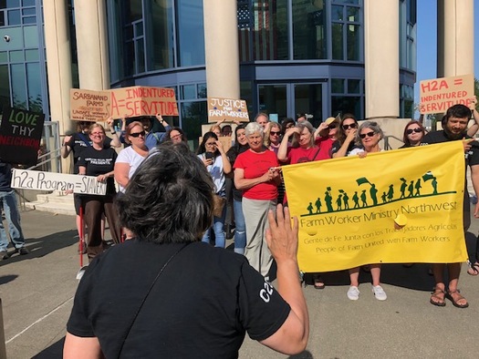 Farm workers' advocates protested Tuesday outside a court hearing about the fine for Sarbanand Farms in Sumas, Wash. (Carla Shafer)
