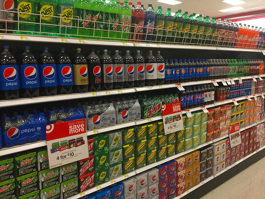 Big soda companies have pumped about $6 million so far into a Washington measure to ban future grocery taxes. (Mike Mozart/Flickr)
