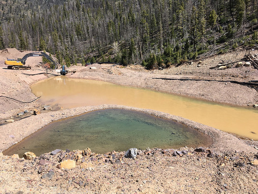 The defunct Mike Horse Mine must be perpetually treated so that it doesn't pollute the nearby Blackfoot River. (Earthworks/Flickr)