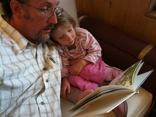 Numerous studies show improved test scores and higher rates of graduation for children who are routinely read to as a child. (Brecken Pool/flickr)