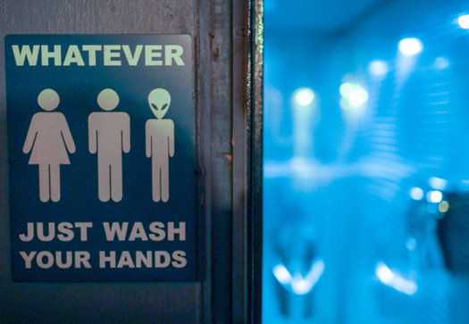 The passage of House Bill 2 and subsequent HB 142 prompted many private businesses to put up gender-neutral restroom signs in North Carolina. (Ted Eytan/Flickr)