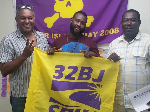 Luc Bastien, left, stands with union brothers at 32BJ SEIU after canvassing. (32BJ SEIU)