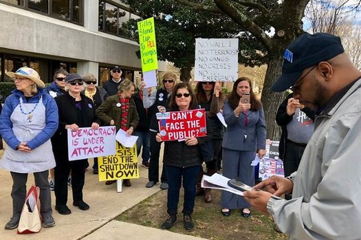 Protesters gathered Tuesday outside the Federal Building for their weekly 