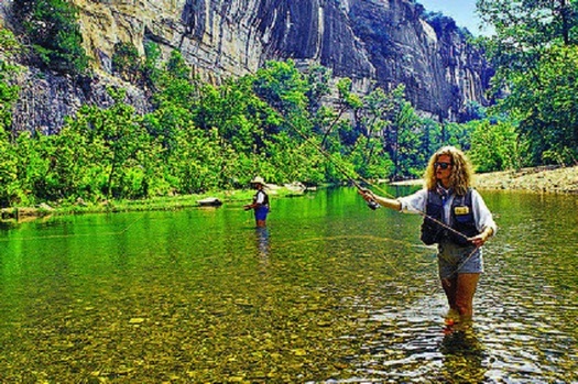 An Arkansas couple casts flies in search of rainbow and brown trout in the clear waters of the Buffalo National River. (Arkansas Dept. of Parks and Tourism)