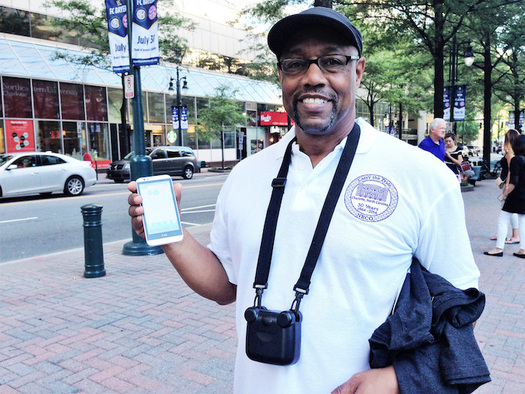 Ronald Ross holds an air-pollution monitoring device used in the AirKeepers project. (Clean Air Carolina)