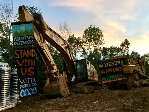 Banners hang from the site of a protest against the Mountain Valley Pipeline, where a protester was arrested on Wednesday for obstructing construction. (Appalachians Against Pipelines)