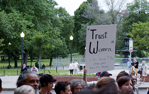 Protesters in Boston denounce anti-abortion violence, holding a sign to honor Dr. George Tiller, an abortion provider who was murdered in Kansas in 2009. (Tim Pierce/Wikipedia)