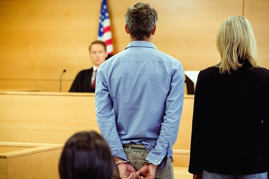 The ACLU of Arizona is challenging a law that requires defendants in some cases to either pay hefty fees for GPS monitors or await their trial date in jail. (wavebreakmedia/Adobe Stock)