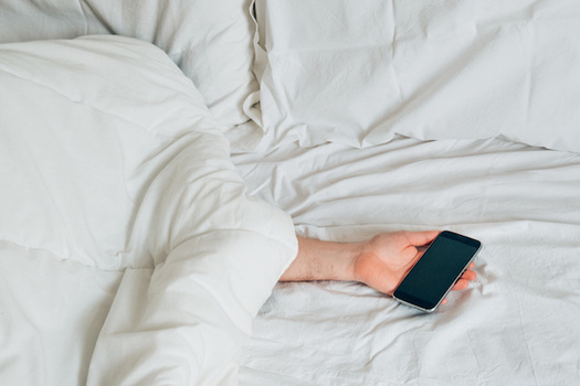 Research finds kids learn better when they have a good night's sleep  and powering down cell phones and other screens could be key. (Paolese/Adobe Stock)