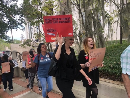 A coalition of Florida organizations rallies in Tallahassee against Senate Bill 7066, which stipulates all prison-related fines must be paid before a person's voting rights can be restored. (Trimmel Gomes) 
