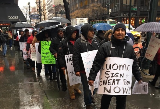 Workers rallying at Gov. Andrew Cuomo's Manhattan office say some employers still get away with wage theft. (NMAS)