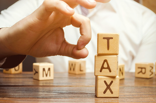 The Tax Cuts and Jobs Act lowered the corporate tax rate from 35% to 21%, but researchers say the average rate paid by companies is 11%. (Adobe Stock)
