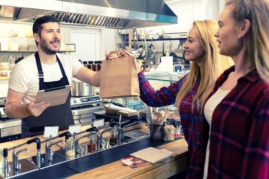 Most Arizona hourly workers, including food service, hospitality and retail employees, received a pay raise on Jan. 1, 2020, under the state's minimum wage law. (rentea/Adobe Stock)