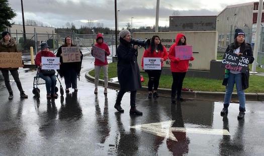 Protesters line up on Friday outside an immigrant holding station in Ferndale, Wash., where they believe a man brutally handled by ICE was being held. (Community to Community Development)